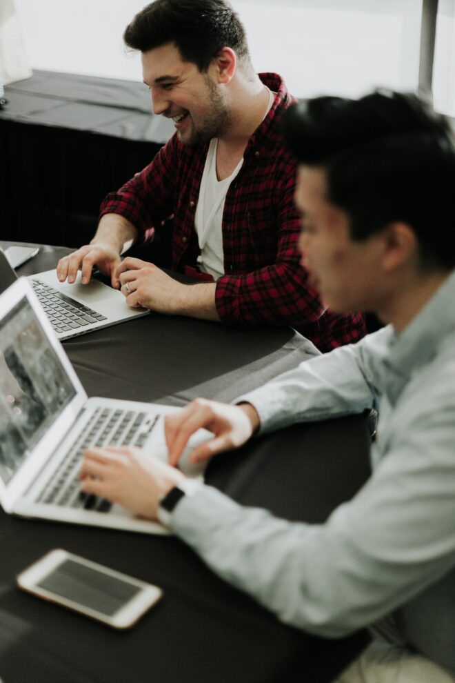 People working on table together