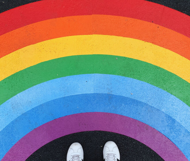 Rainbow sign on pavement